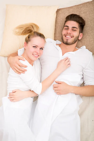 Happy young couple in Bed Royalty Free Stock Photos